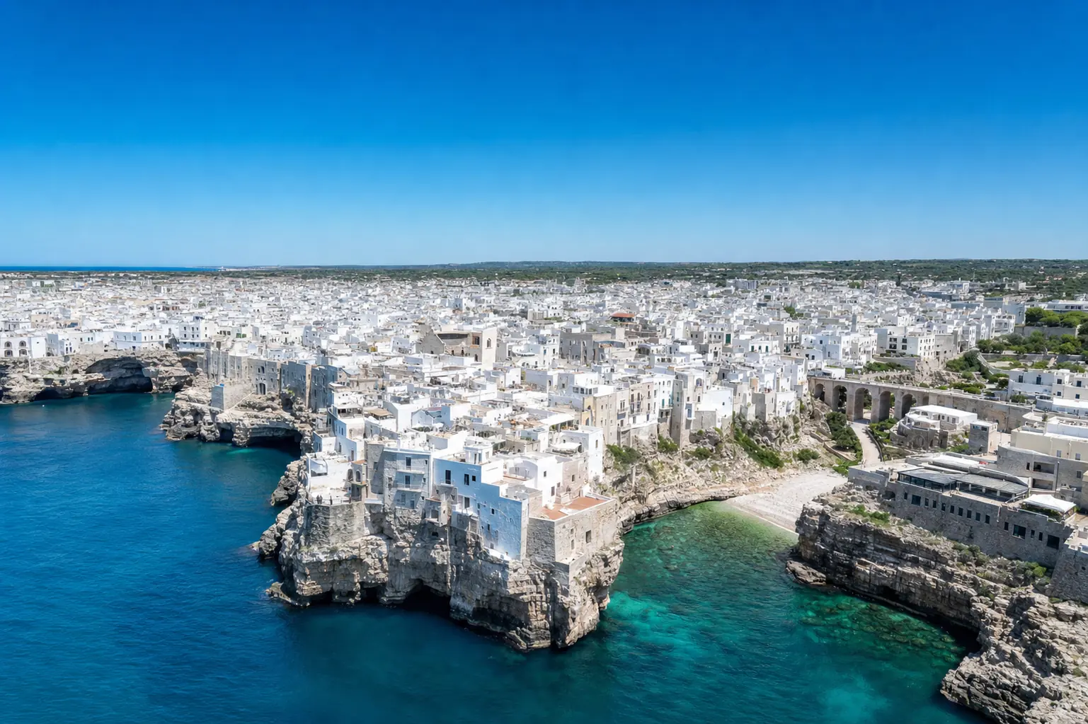 The Polignano coast from the water, morning