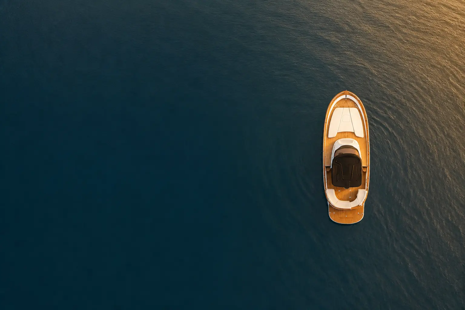 The Libeccio 8.5 from above at golden hour, open water around it